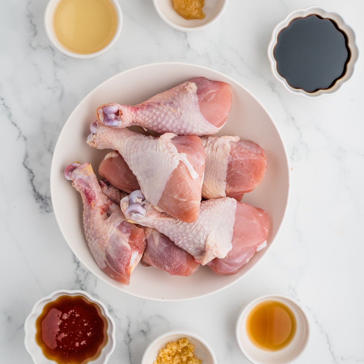 Ingredients needed for Air Fryer Honey Soy Chicken Drumsticks on kitchen table.