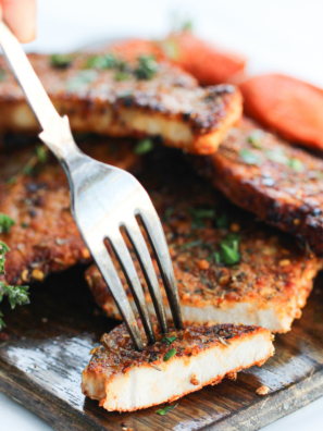 Golden-brown air fryer pork steaks on a plate, ready to serve