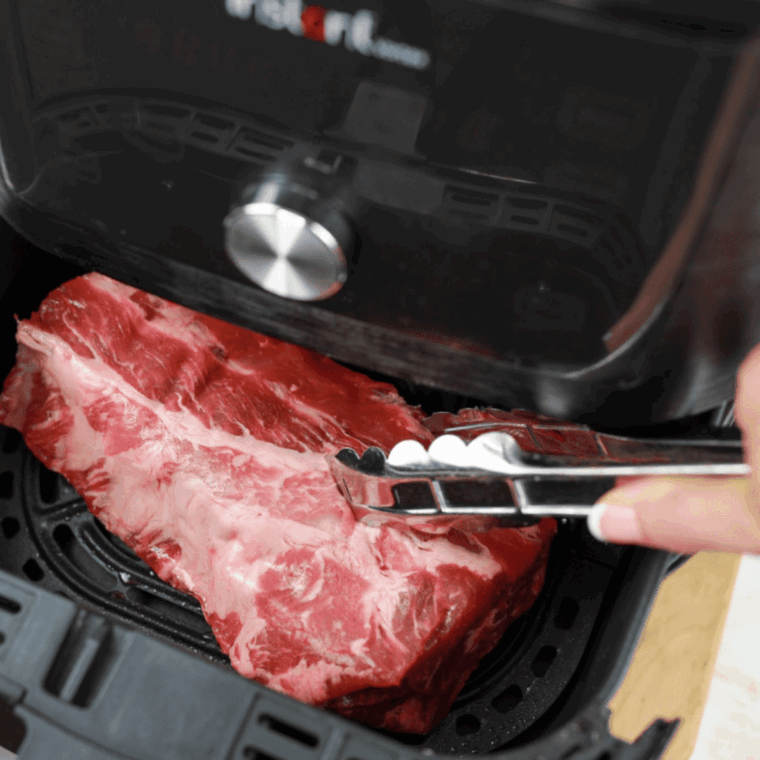 Place the ribs in the air fryer basket.