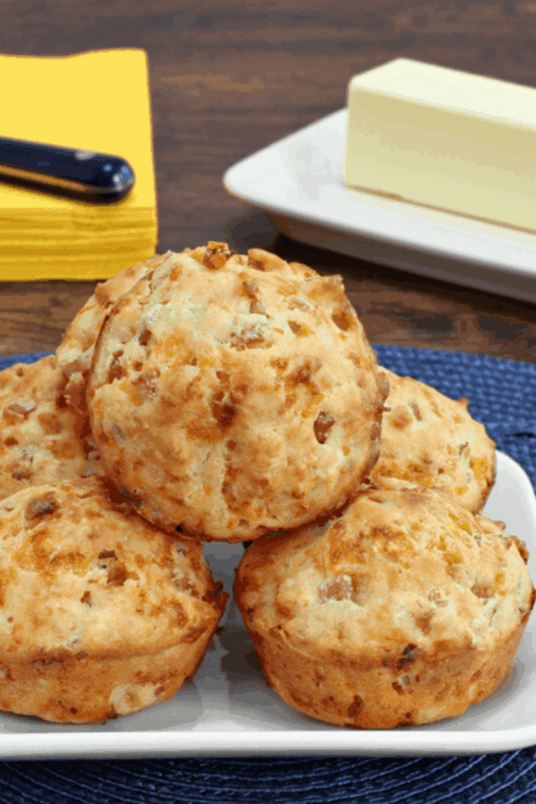 Golden air fryer savory muffins with melted cheddar, crispy bacon, and fresh basil