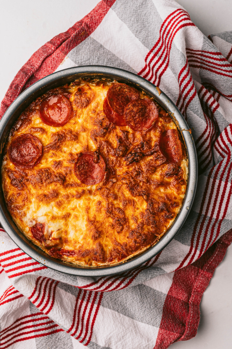 Air fryer bubble-up pizza bake topped with melted cheese and pepperoni slices