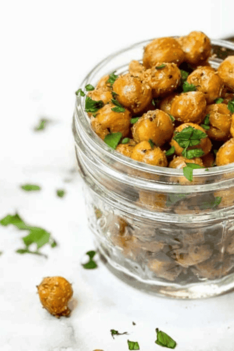 Golden, crispy Air Fryer Garlic and Herb Roasted Chickpeas in a bowl, seasoned with herbs and garlic, ready to eat.