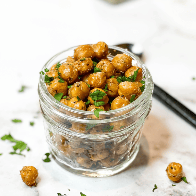 Mason jar filled with Easy Air Fryer Garlic and Herb Roasted Chickpeas.