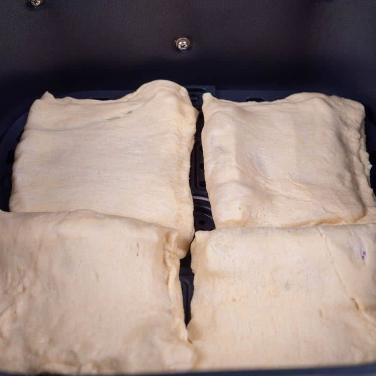 Place the homemade home and cheese hot pockets in the air fryer