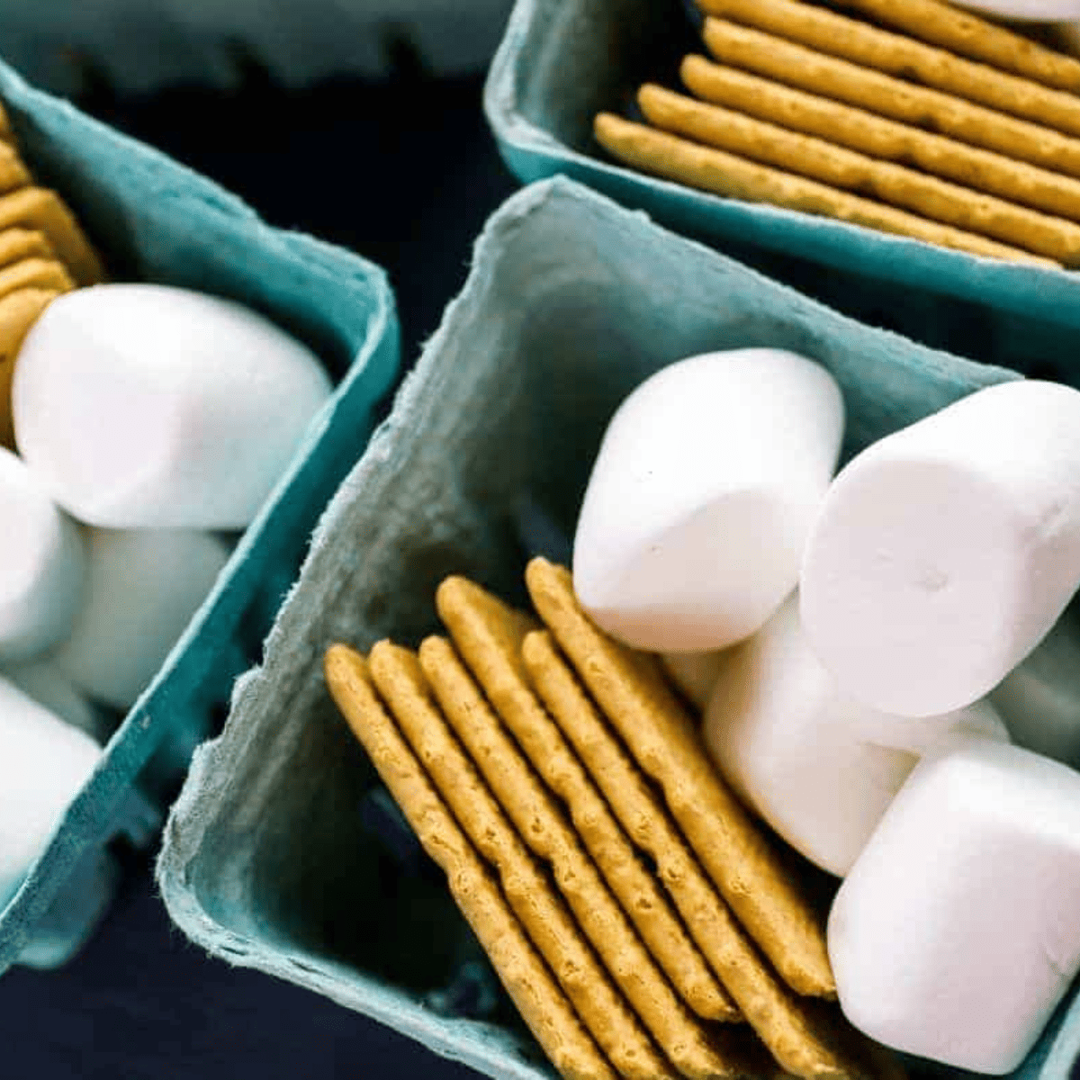 Ingredients for Air Fryer S'mores Brownies: brownie mix, eggs, oil, graham crackers, and mini marshmallows