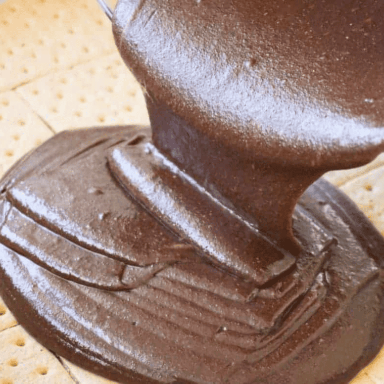 Remaining brownie batter poured over the graham cracker layer