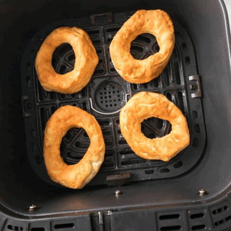 Cooked Dunkin Donuts Sprinkle Donuts Recipe in the air fryer basket.