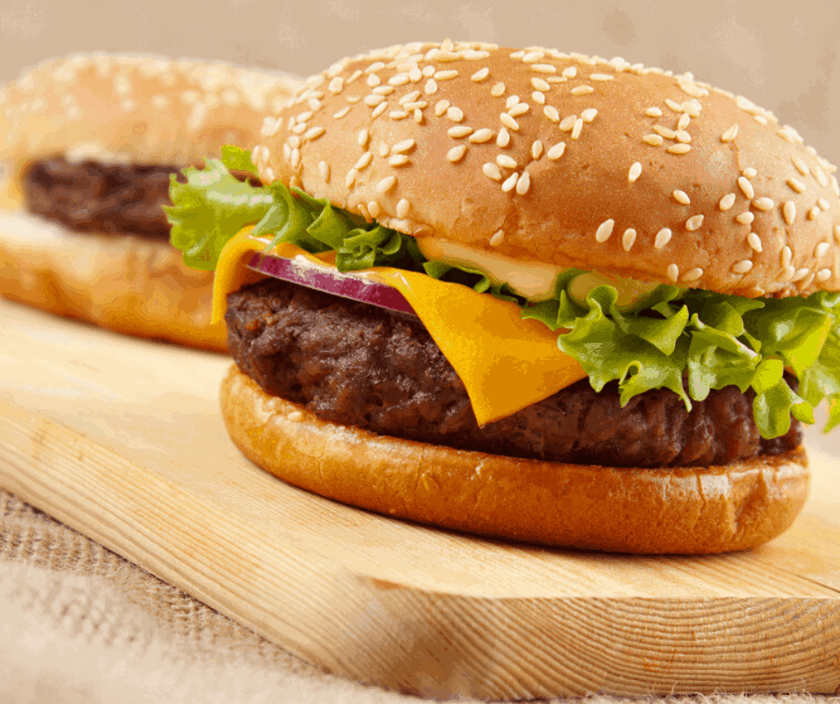 Smear the butter evenly on the top and bottom of the hamburger buns so they toast evenly.
Toasting the hamburger buns for 2-3 minutes is a guideline and may change depending on your particular brand of air fryer or the size of the buns. Always watch the buns while they are toasting to prevent them from browning too quickly or from burning!
If you have cut the hamburger buns in half so that the halves are separated, it’s a good idea to flip the halves midway the cooking time for an even crisp on all sides.
Toast the hamburger buns in batches to avoid overcrowding the air fryer basket. There needs to be sufficient airflow in the air fryer to achieve an even crispy exterior.
Add flavor to the hamburger buns by sprinkling your favorite seasonings, spices, herbs, or grated cheese over them once they are buttered. You could also use compound butter.
Remove the hamburger buns immediately from the air fryer to prevent them from turning soggy.