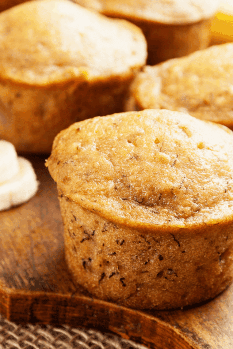 Golden air fryer banana nut muffins with moist centers and crunchy nuts, freshly baked and ready to enjoy.