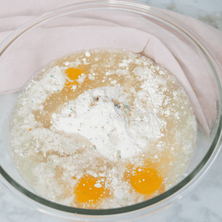 Adding eggs, oil, and water to cake mix for air fryer birthday cake batter