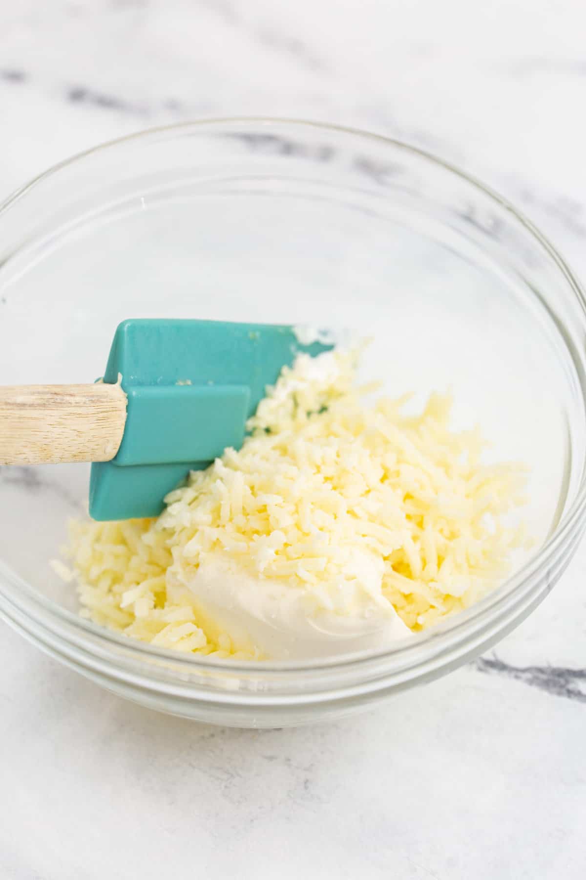 "Caramelized onions and cheese mixed together for Air Fryer French Onion Dip."