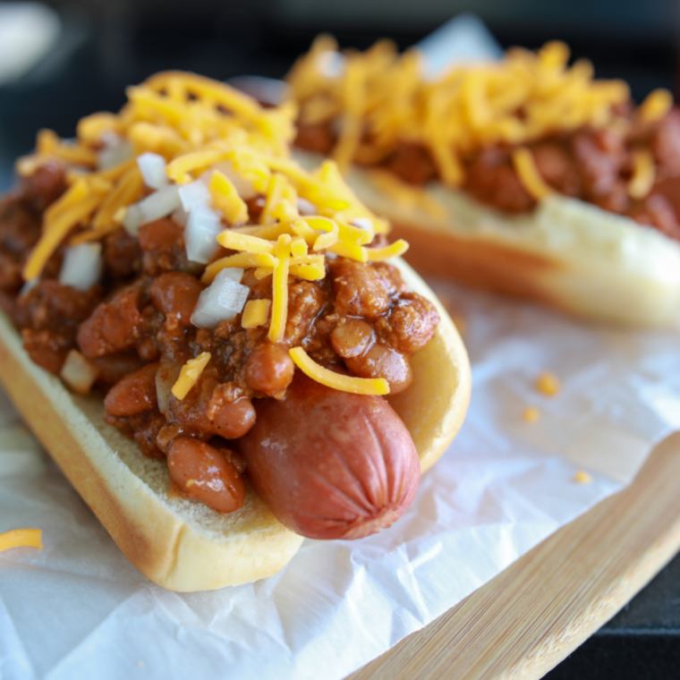 Finished hot dogs topped and served fresh with crispy snap texture.