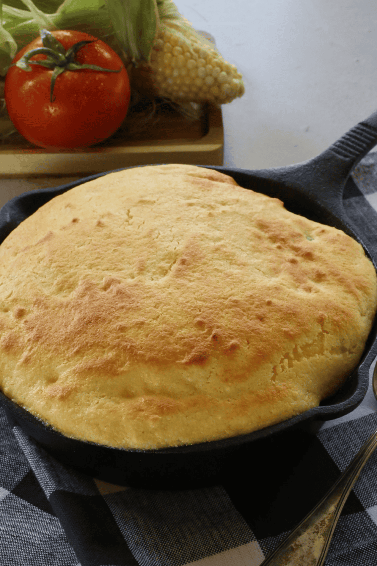 Golden, fluffy Air Fryer Skillet Cornbread with crispy edges, freshly cooked in a cast iron skillet
