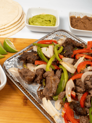 Indulge in these delectable air fryer steak tacos featuring marinated ribeye steak cooked to perfection. This traditional Mexican dish is a hassle-free and flavorful addition to your weeknight dinner lineup of air fryer recipes. If you are looking recipe for Taco Tuesday, this is one of the best; cooked in your air fryer basket and served with your favorite toppings, this recipe can not be beat!