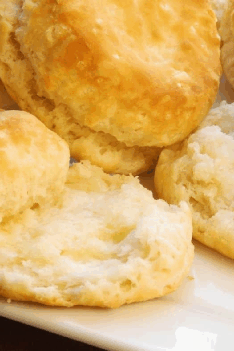 Golden, fluffy Copycat Waffle House biscuits stacked on a plate