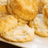 "Golden, fluffy Copycat Waffle House biscuits stacked on a plate"