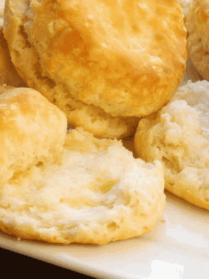 "Golden, fluffy Copycat Waffle House biscuits stacked on a plate"