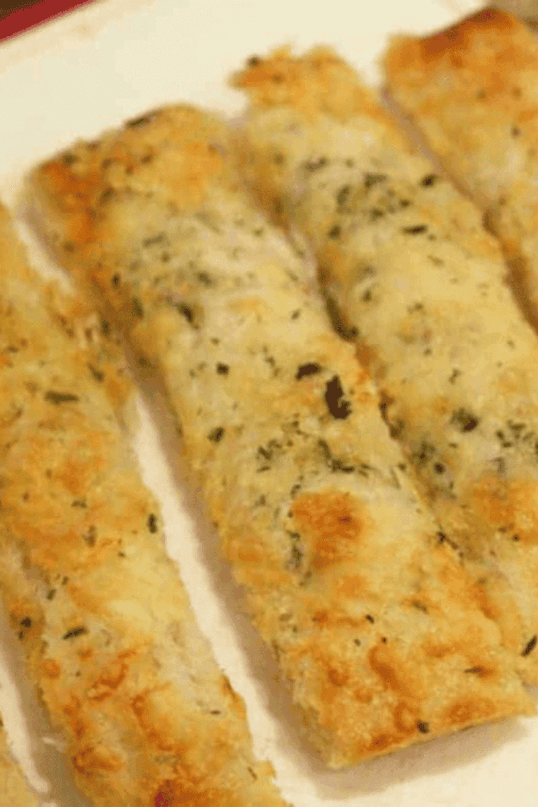 golden brown air fryer cheesy bread sticks with melted cheese