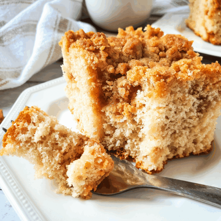 Easy yellow cake mix coffee cake with cinnamon-sugar topping served on a plate.