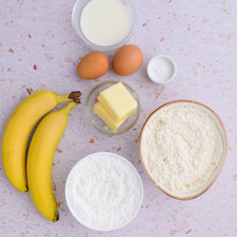 Ingredients for Ninja Crispi banana bread including ripe bananas, flour, brown sugar, eggs, and butter