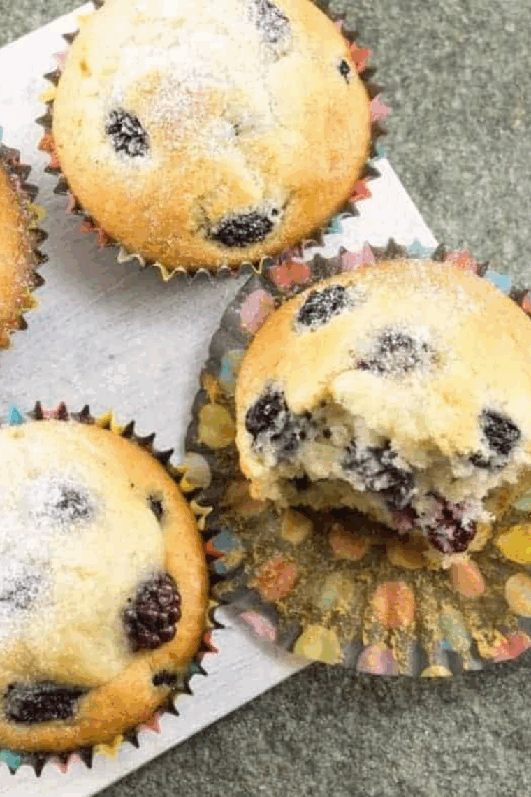 Golden air fryer muffins with juicy blackberries, zesty lemon, and sprinkled poppy seeds