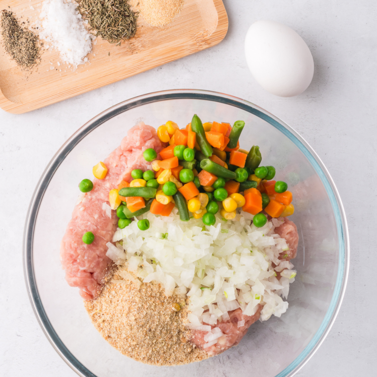 Chicken patty mixture mixed just until the seasonings are evenly distributed, still loose in texture