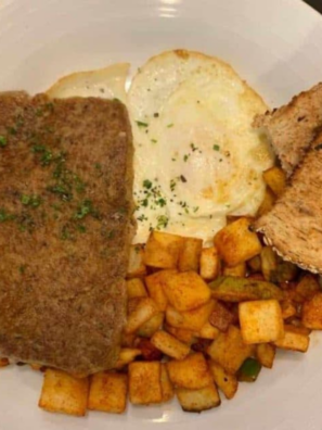 Close-up of crispy browned air fryer scrapple slices on a plate