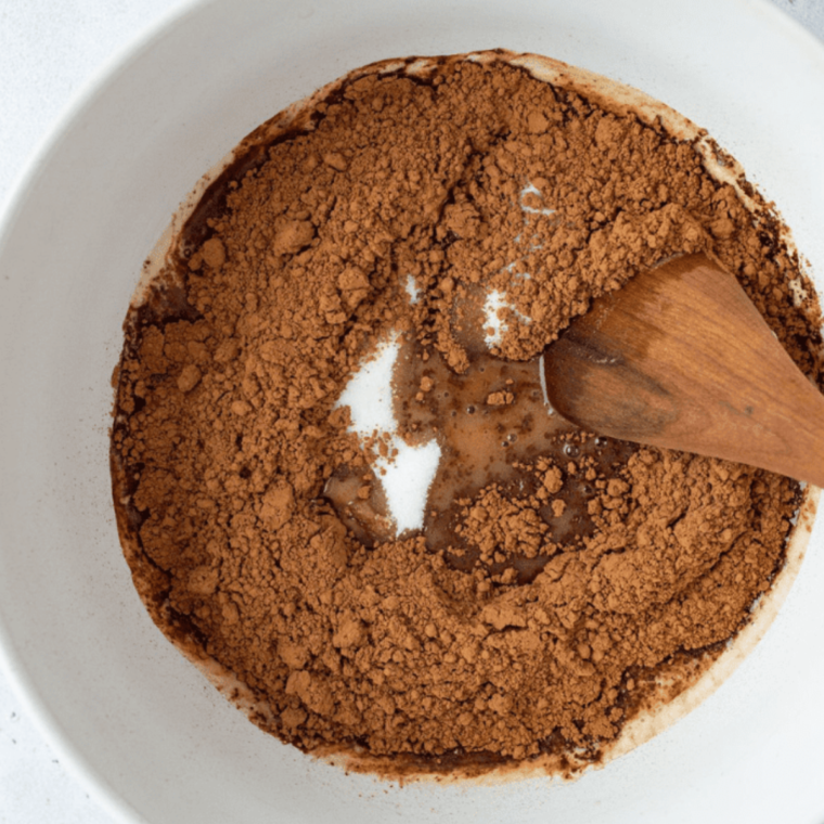 Whisk together flour, cocoa powder, baking soda, and salt in a medium bowl. In a separate bowl, beat butter, brown sugar, and granulated sugar until creamy, then mix in egg and vanilla extract.