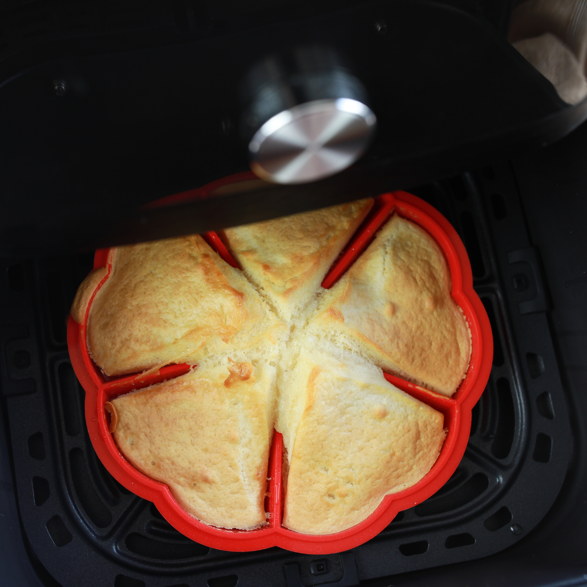 Cooked waffle in the air fryer basket.
