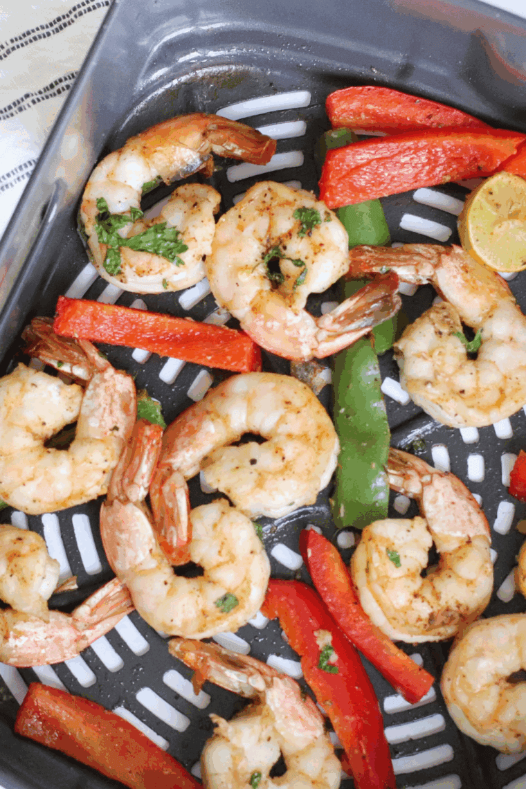 Cooked pesto shrimp finished with fresh lemon juice and Parmesan cheese