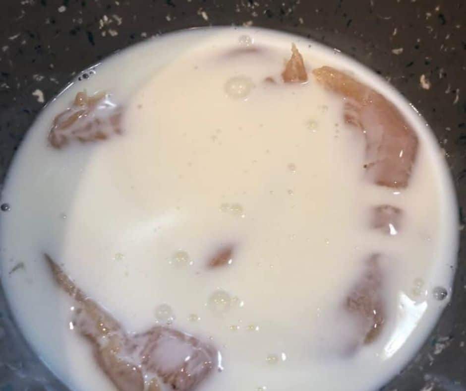 Start by placing the chicken tenders in a large bowl, and then pour the buttermilk over them. Refrigerate for about 20- 30 minutes.