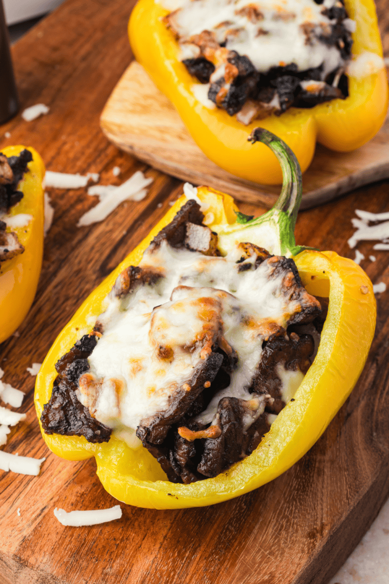 Air Fried Philly Cheesesteak Stuffed Peppers with melted cheese, tender steak, and colorful bell peppers.
