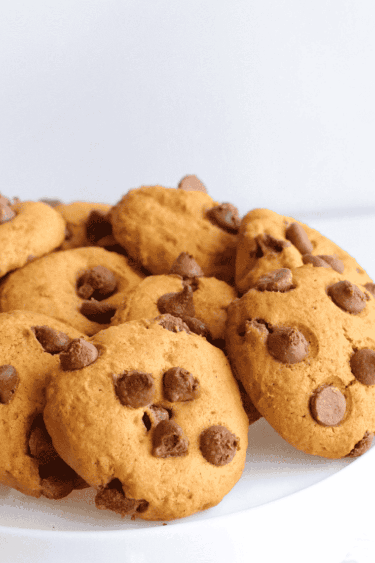 Plate of soft peanut butter chocolate chip cookies with gooey chocolate chips, fresh from the air fryer.