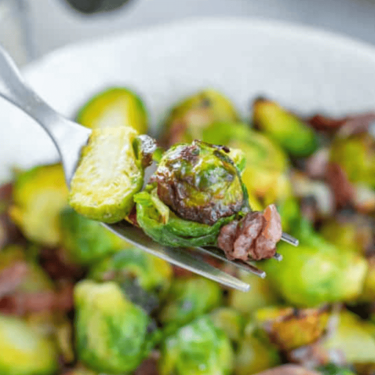 Longhorn Steakhouse crispy Brussels sprouts with golden caramelized edges tossed in a sweet-and-spicy glaze