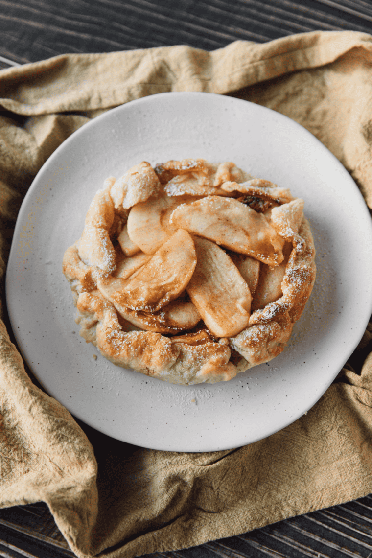 Easy air fryer apple galette sliced and served warm with a flaky buttery crust