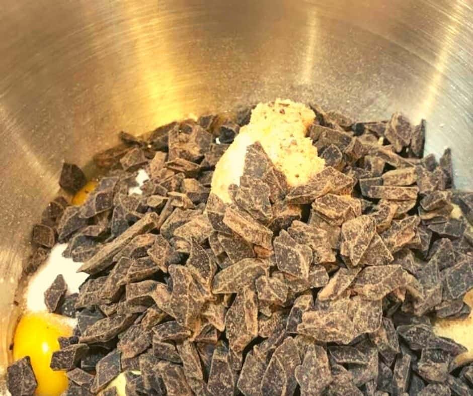In a large mixing bowl, mix together the flour, baking soda, salt, butter, sugar, brown sugar, eggs, and vanilla extract.