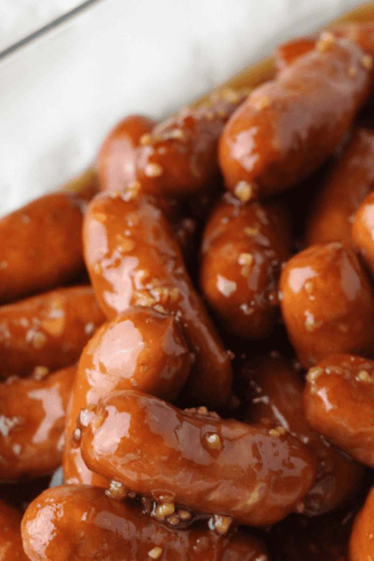 Grape jelly little smokies appetizer on a platter with toothpicks for a party