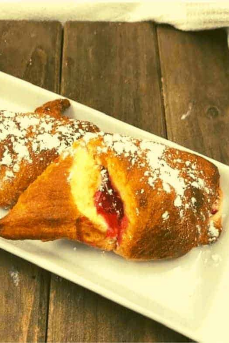 Golden crescent rolls filled with cream cheese and cherry pie, fresh from the air fryer.