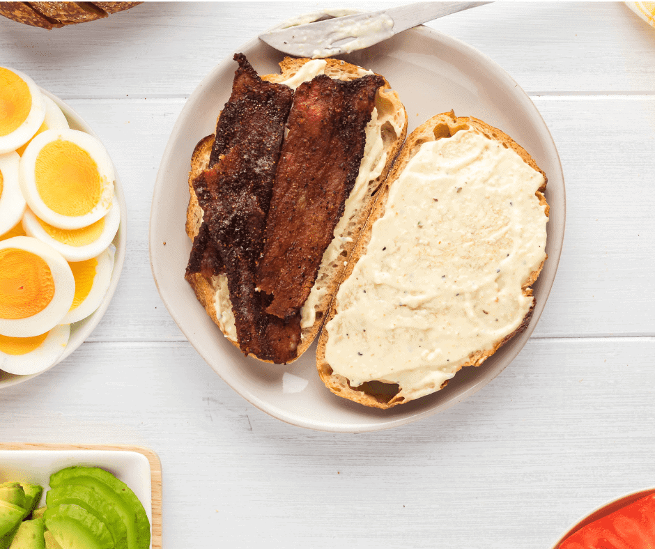 Air fryer basket with crispy candied bacon, glazed with a sweet and spicy maple syrup mixture.