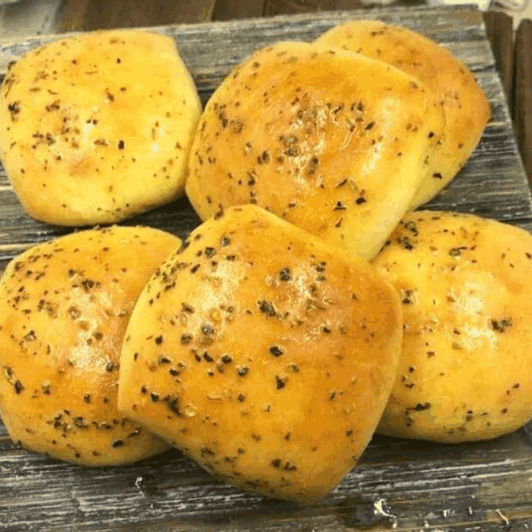 Fresh batch of homemade Bob Evan's Dinner Rolls Recipe on the kitchen counter.