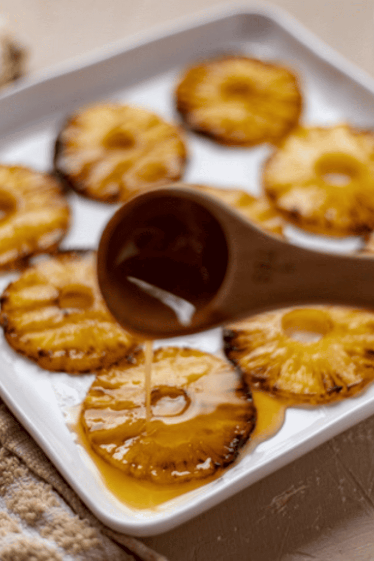 Golden honey glazed pineapple rings fresh from the air fryer, caramelized and juicy.