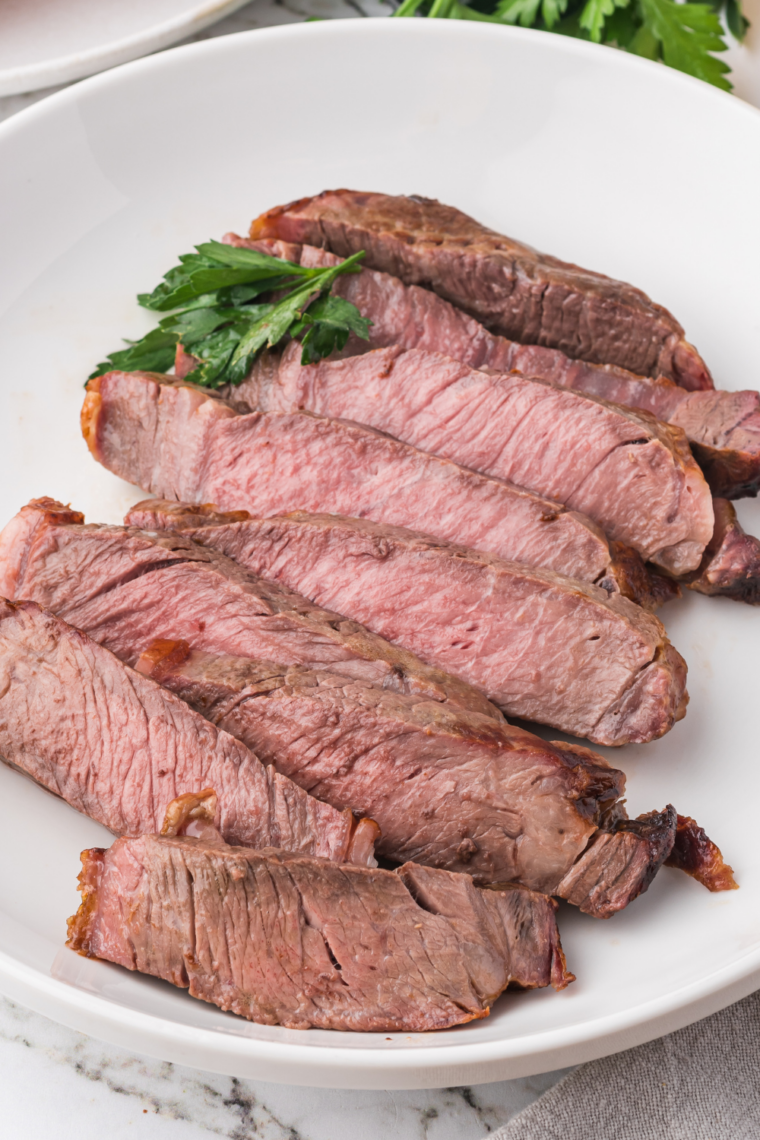 Sliced Ninja Crispi ribeye showing a medium-rare pink center and marbled crust