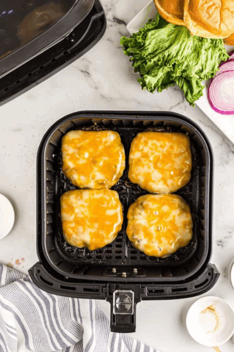 Lightly butter the burger buns and place them in the air fryer at 350°F (175°C) for 2-3 minutes, until golden and slightly crispy.