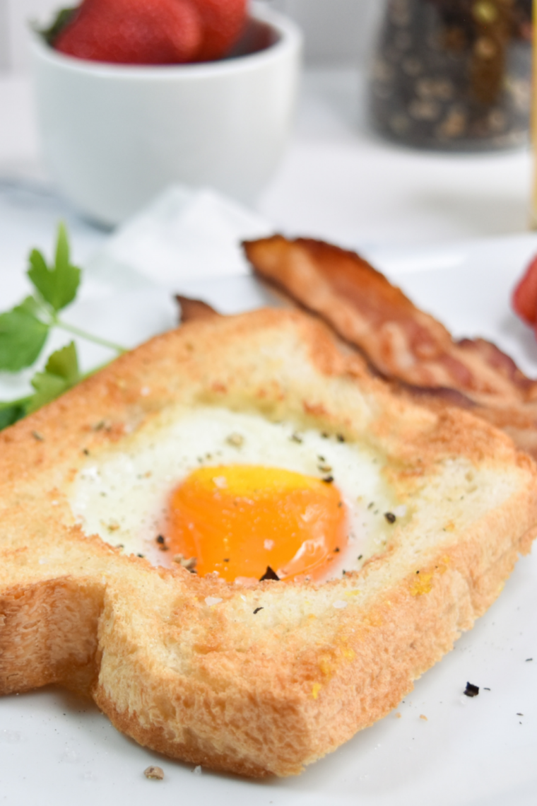 Close-up of a runny egg yolk in the center of air fryer toast