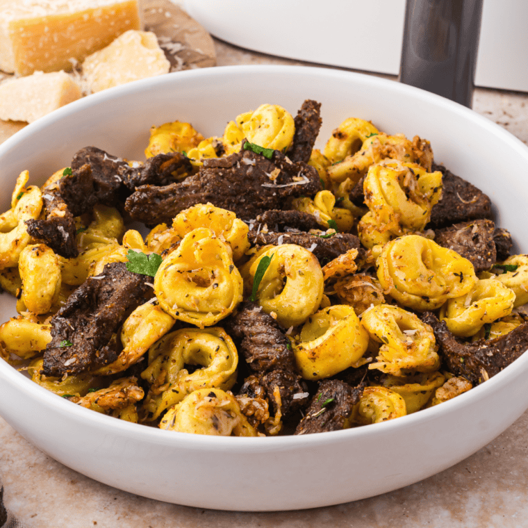 Air-fried Parmesan-crusted steak with a crispy, golden exterior and tender, juicy interior, perfectly cooked in the air fryer.