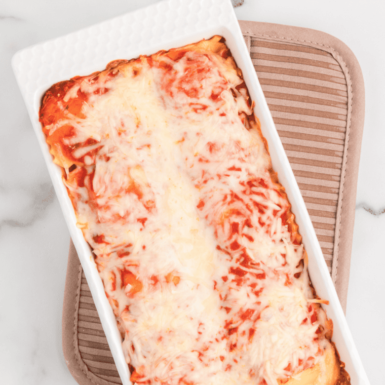 Air Fryer Ravioli Lasagna with crispy ravioli, marinara sauce, and melted cheese in a golden crust.