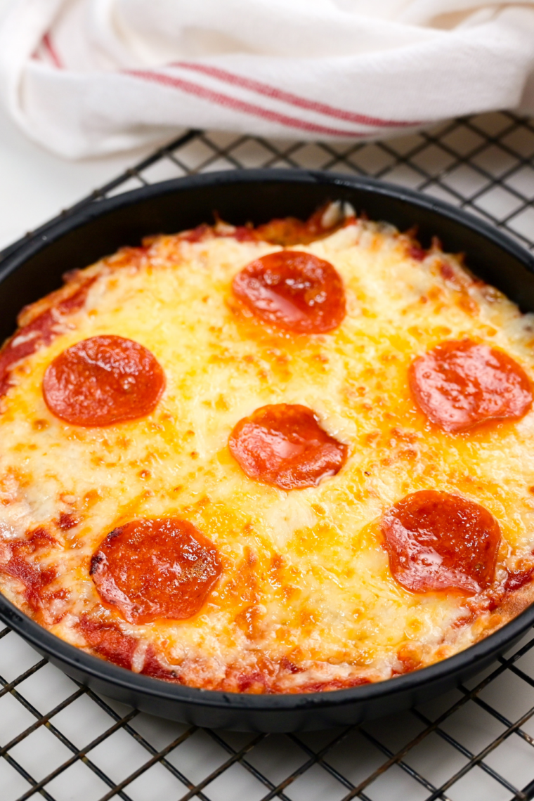 Air fryer sheet pan pizza recipe pin — crispy homemade pizza cut into squares with recipe title overlay