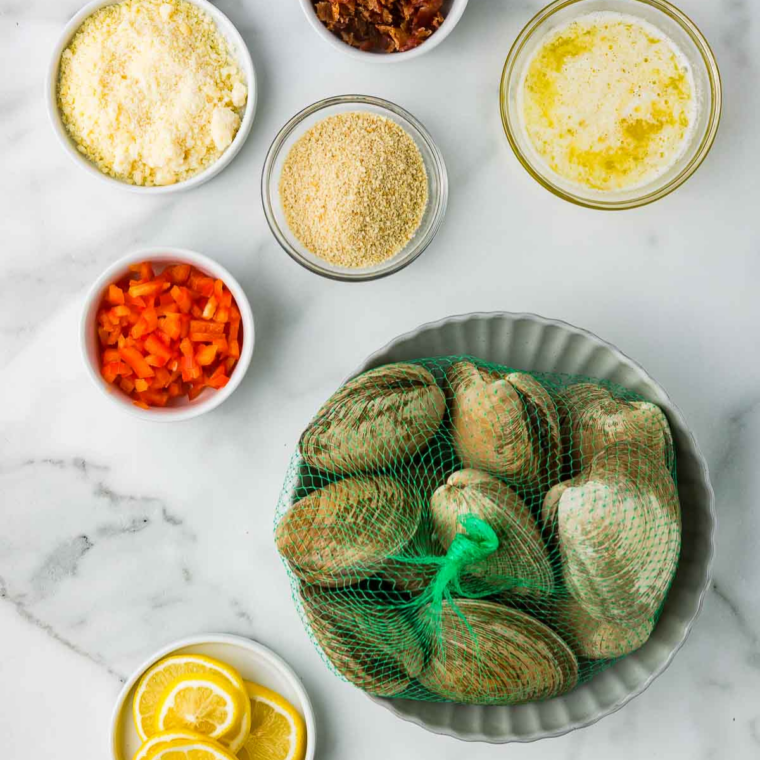 Ingredients for homemade stuffed clams: quahogs, breadcrumbs, butter, onion, and celery