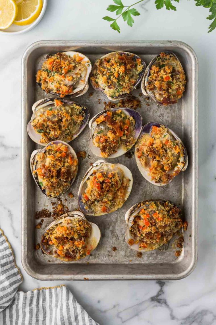 Homemade air fryer stuffed clams with crisp golden tops and a lemon garnish