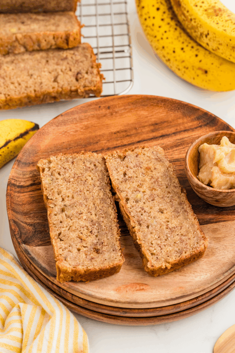 Slice of Easy Banana Bread made with shortening, showing soft, moist texture and golden-brown crust on a plate.